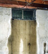 Flooding through basement windows in a Astoria home.
