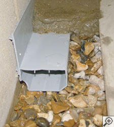 A no-clog basement french drain system installed in Mount Sterling