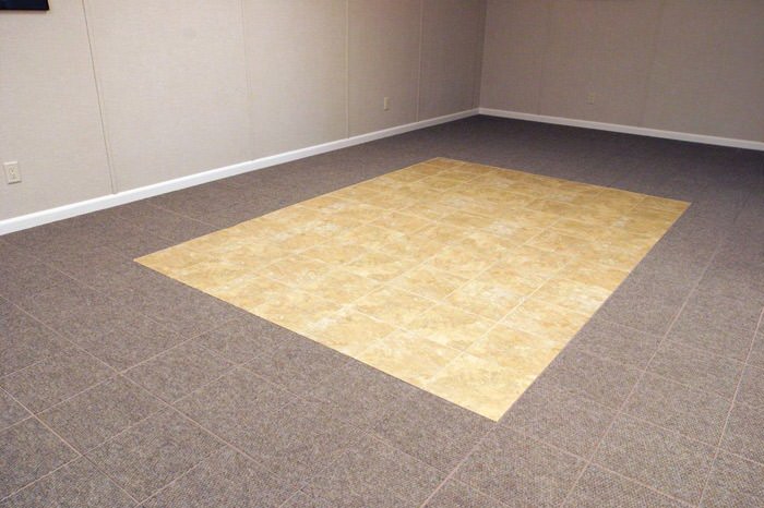 tiled and carpeted basement flooring installed in a Fort Madison home