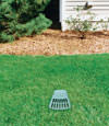A buried gutter drain downspout extension installed in a Astoria home