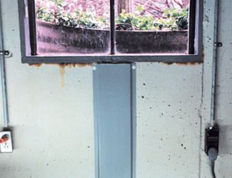 Repaired waterproofed basement window leak in Peoria
